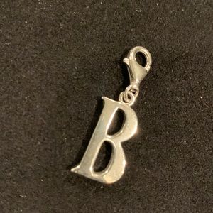 Silver “B” charm with claw clasp.